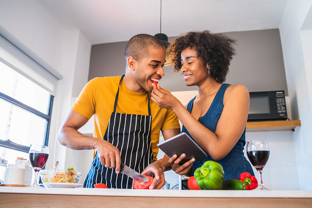 Couple cooking in the kitchen together.